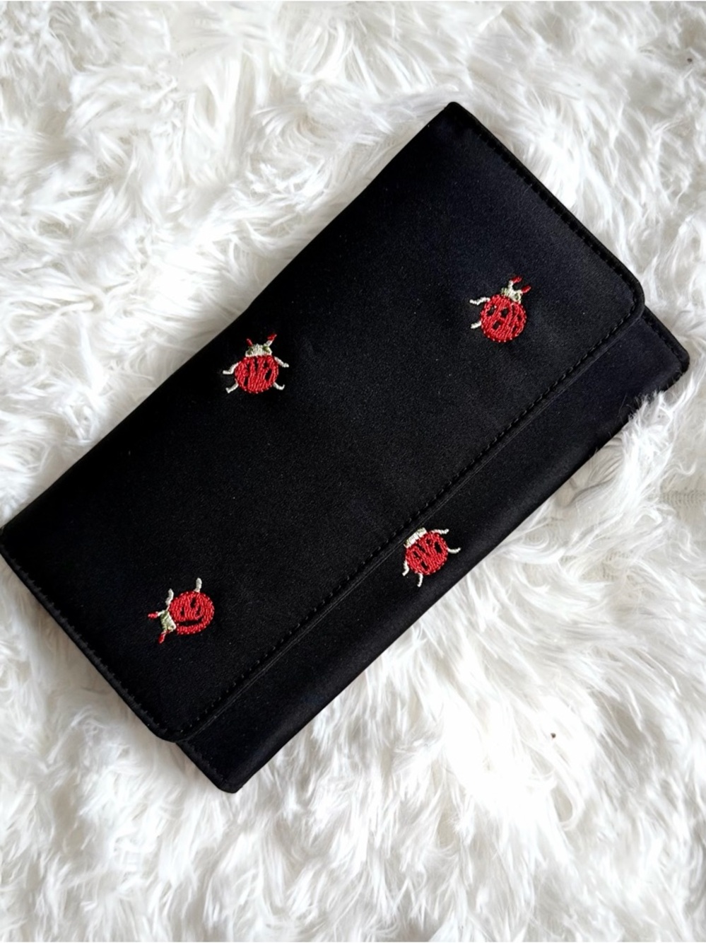 Elegant Black Clutch with Red Embroidered Ladybug Accents